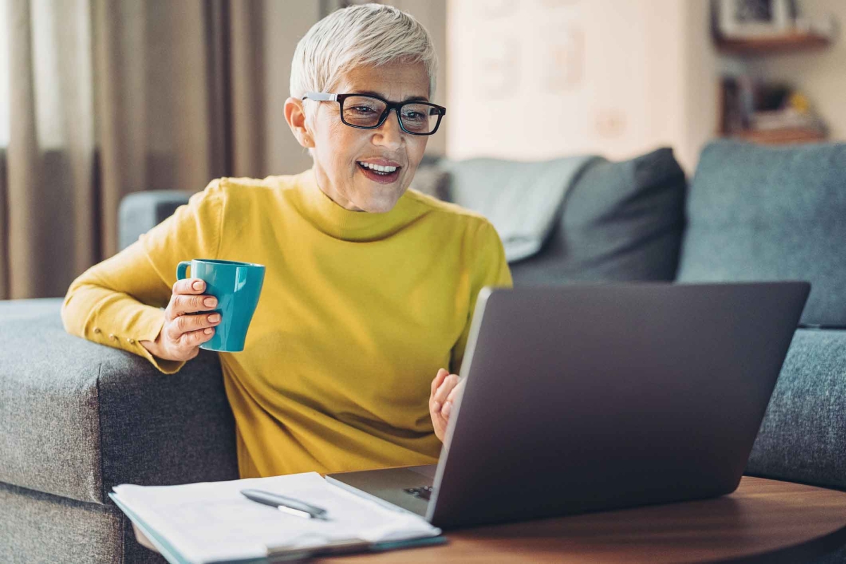 Mature woman working from the comfort of her home