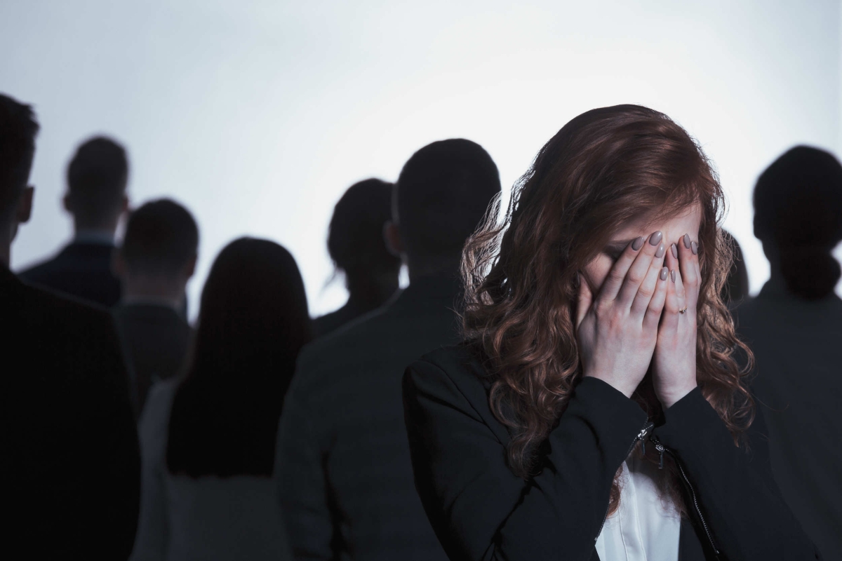 Worried woman at a networking event