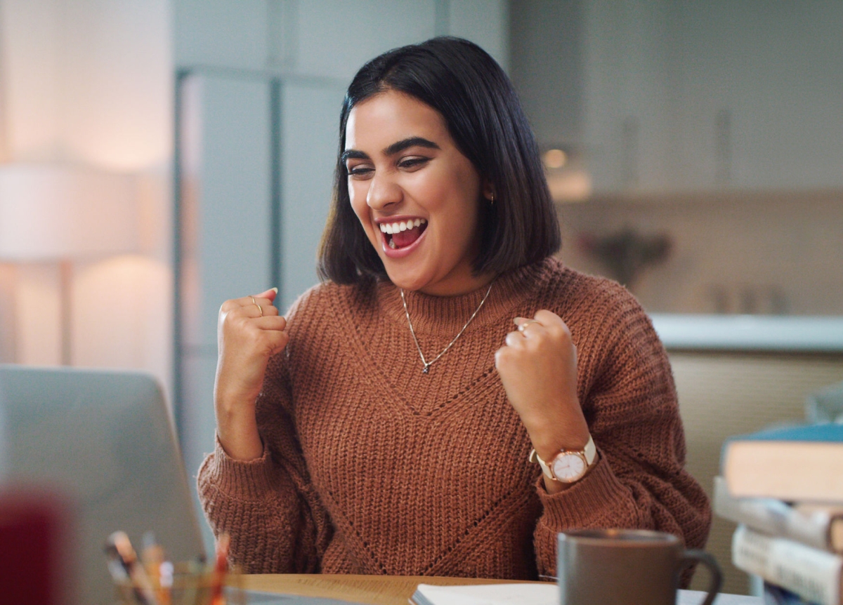 A woman celebrating her achievement